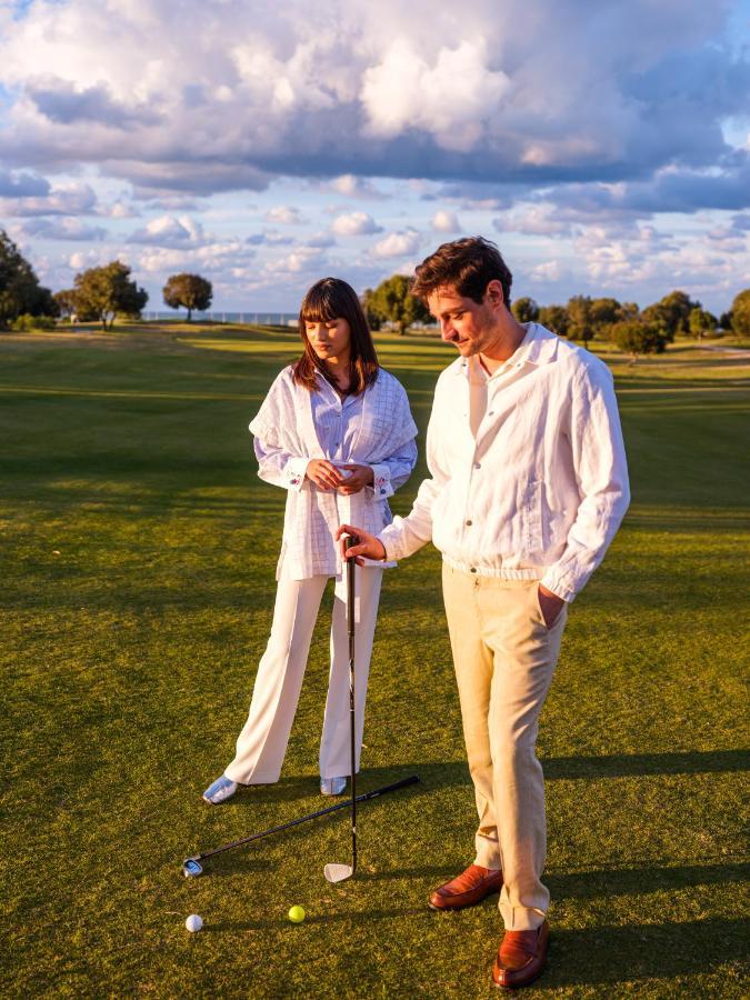 Vichy Célestins Spa Hôtel Casablanca Bouznika Esterno foto Golfers wearing white